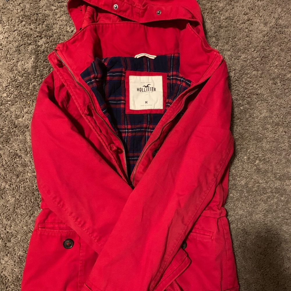 Red Hollister coat.